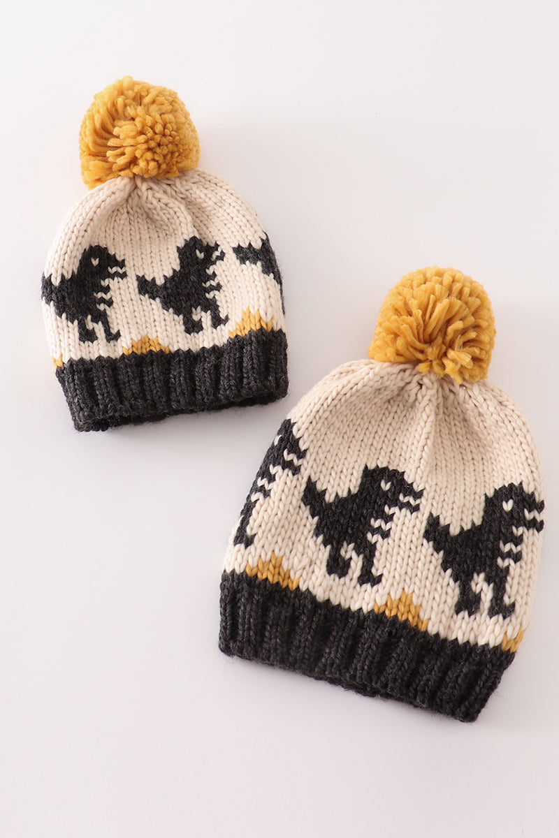 Black pompom dinosaur cable beanie